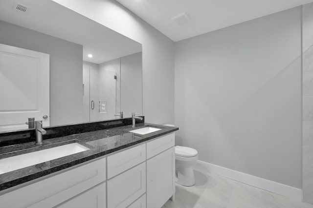 12390 Green Ridge Dr, Willis, TX 77318 - full bath with visible vents, a sink, a stall shower, and toilet