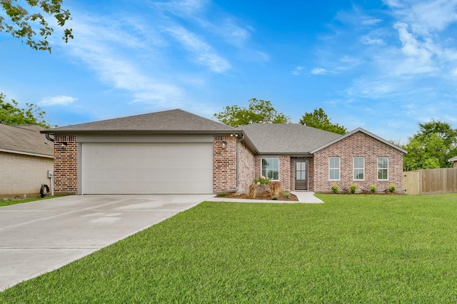 12390 Green Ridge Dr, Willis, TX 77318 - single story home with concrete driveway, brick siding, an attached garage, and a front lawn