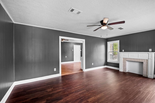 unfurnished living room featuring visible vents, a ceiling fan, and wood finished floors