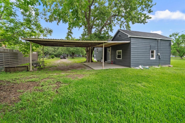 exterior space featuring a yard and a patio