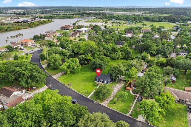 birds eye view of property with a water view and a residential view