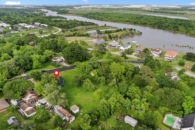 drone / aerial view with a residential view and a water view