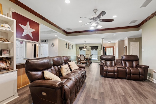 living room with recessed lighting, ceiling fan, ornamental molding, and wood finished floors