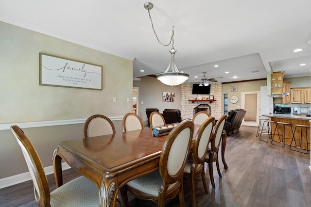dining room with recessed lighting, a ceiling fan, dark wood finished floors, and ornamental molding