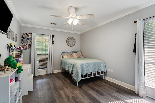 bedroom featuring crown molding, baseboards, dark wood-type flooring, and visible vents