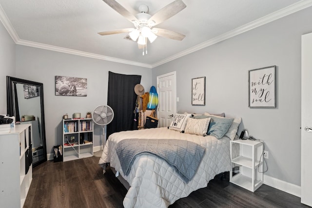 bedroom with crown molding, baseboards, and dark wood-type flooring