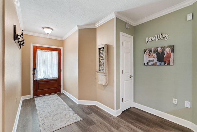 entryway featuring baseboards, ornamental molding, a textured ceiling, and dark wood-style floors