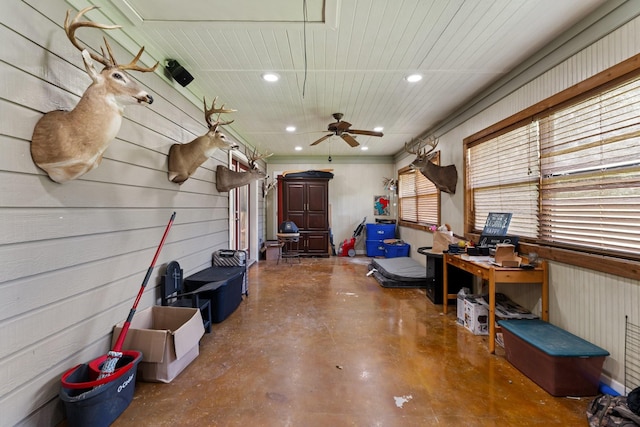 miscellaneous room with recessed lighting, a ceiling fan, and concrete floors