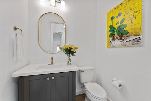 15631 Audubon Park Dr, Magnolia, TX 77354 - bathroom with baseboards, vanity, and toilet
