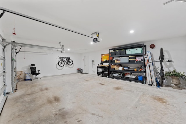 15631 Audubon Park Dr, Magnolia, TX 77354 - garage with a garage door opener and recessed lighting