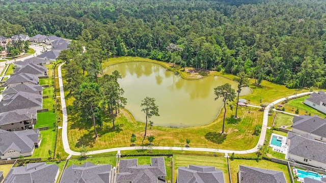 15631 Audubon Park Dr, Magnolia, TX 77354 - aerial perspective of suburban area featuring a heavily wooded area and a nearby body of water