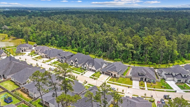 15631 Audubon Park Dr, Magnolia, TX 77354 - aerial view of residential area with a forest