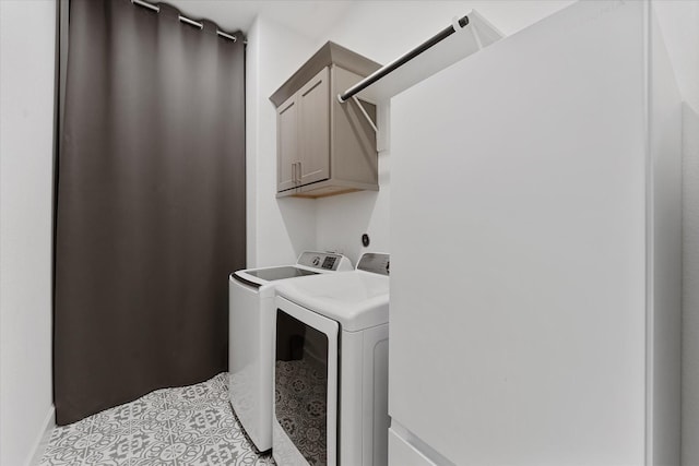15631 Audubon Park Dr, Magnolia, TX 77354 - laundry area with separate washer and dryer, light tile patterned floors, and cabinet space