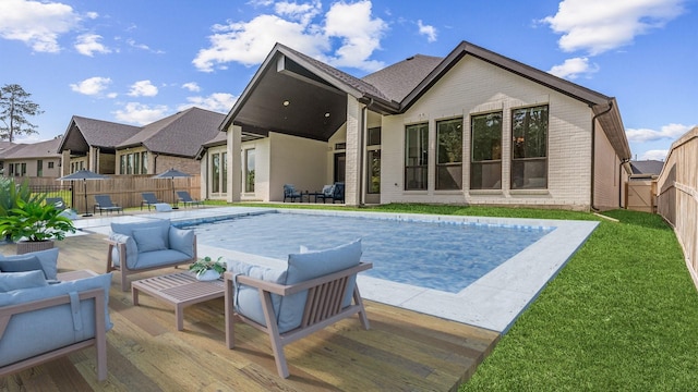 15631 Audubon Park Dr, Magnolia, TX 77354 - rear view of property featuring brick siding, a patio area, and an outdoor living space