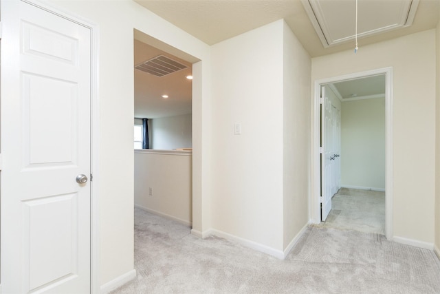 corridor with attic access, carpet, baseboards, and recessed lighting