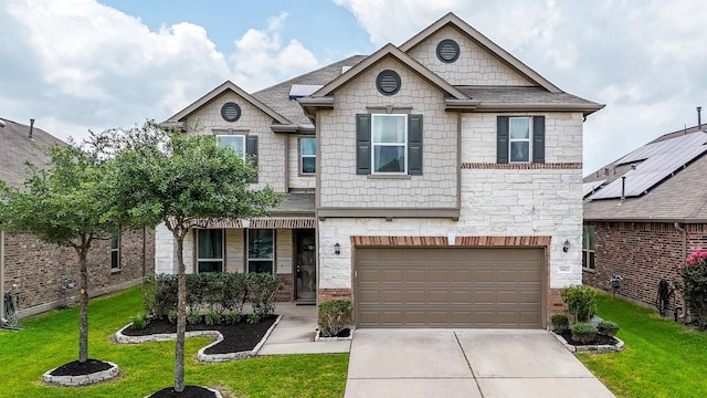 view of front of property featuring concrete driveway, a front lawn, stone siding, a garage, and a shingled roof