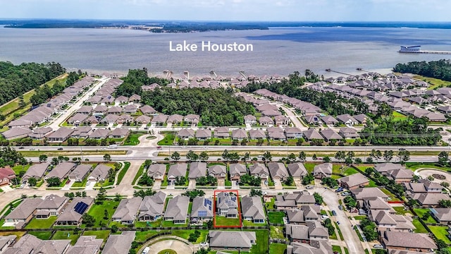 aerial view of residential area with a nearby body of water