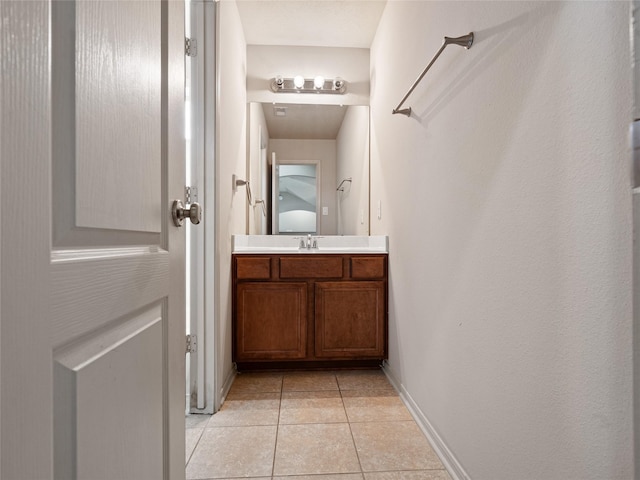 2513 Crestmoon Ct, Houston, TX 77089 - bathroom with vanity, baseboards, and tile patterned floors