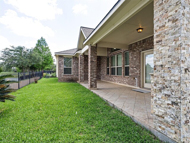 2513 Crestmoon Ct, Houston, TX 77089 - view of yard featuring a patio and fence