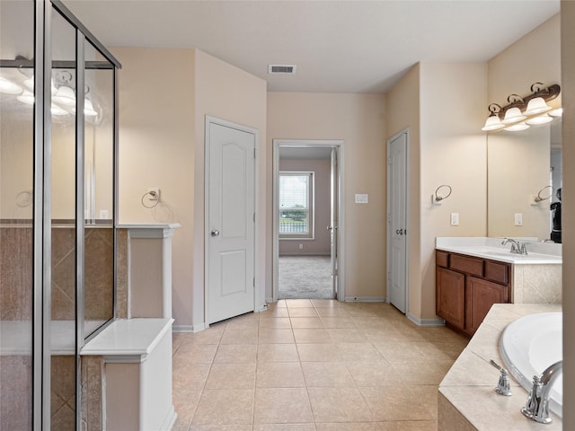 2513 Crestmoon Ct, Houston, TX 77089 - full bathroom featuring a bath, visible vents, tile patterned floors, baseboards, and vanity