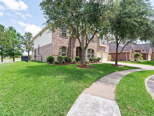 2513 Crestmoon Ct, Houston, TX 77089 - view of front of property featuring fence, a front lawn, brick siding, a garage, and driveway