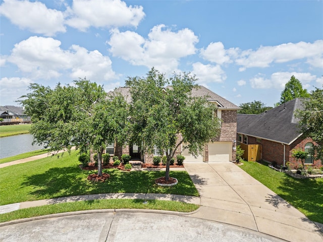 2513 Crestmoon Ct, Houston, TX 77089 - view of property hidden behind natural elements featuring brick siding, a front lawn, concrete driveway, a water view, and an attached garage