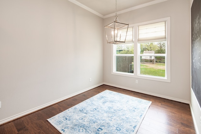 unfurnished dining area with baseboards, ornamental molding, dark wood-style flooring, and a notable chandelier