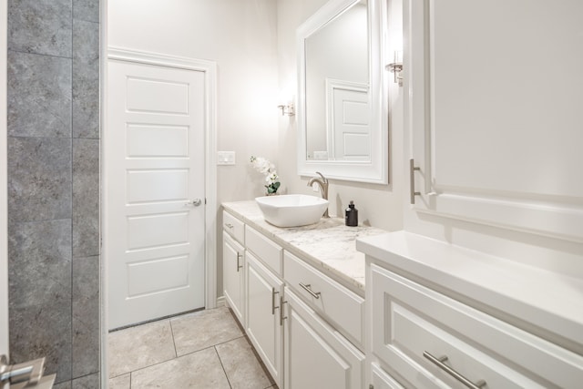 bathroom with tile patterned floors and vanity