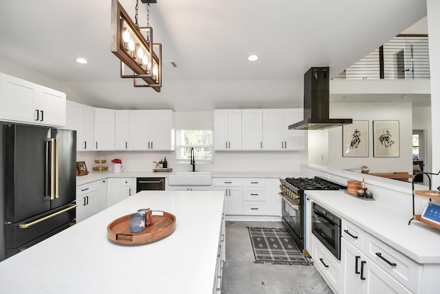 23058 Mills Rd, Porter, TX 77365 - kitchen featuring high end black fridge, island range hood, light countertops, a sink, and gas stove