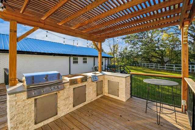 23058 Mills Rd, Porter, TX 77365 - wooden deck featuring fence, a pergola, a grill, exterior kitchen, and a yard