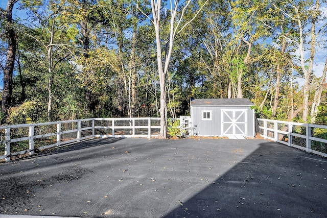 23058 Mills Rd, Porter, TX 77365 - view of patio / terrace with a storage shed, fence, and an outdoor structure