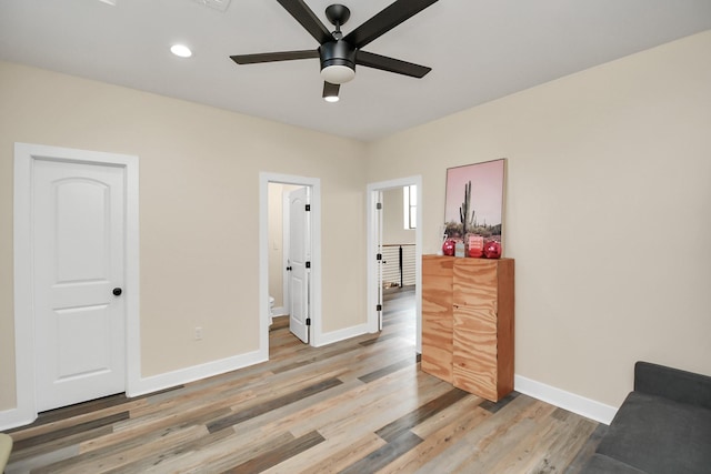 23058 Mills Rd, Porter, TX 77365 - bedroom featuring baseboards, recessed lighting, and wood finished floors