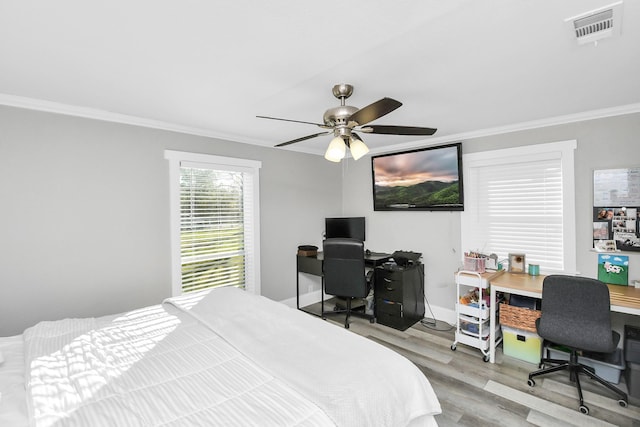 23058 Mills Rd, Porter, TX 77365 - bedroom featuring a ceiling fan, visible vents, ornamental molding, and wood finished floors