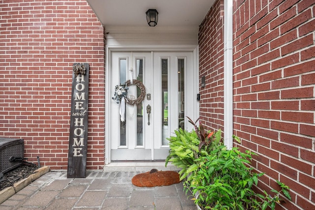 2722 Masters Dr, League City, TX 77573 - doorway to property featuring brick siding
