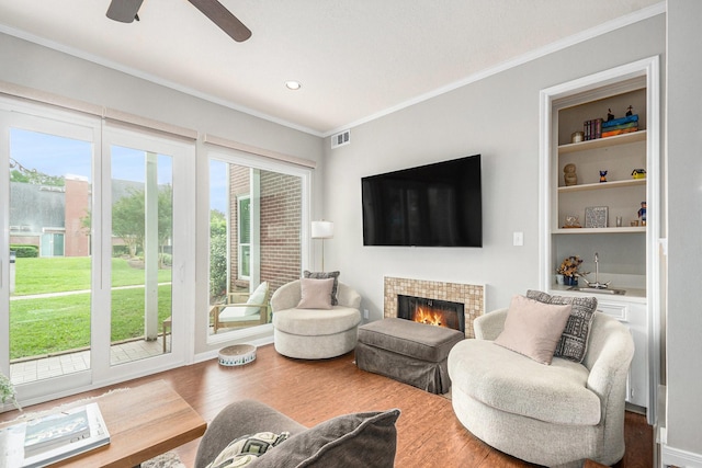 2722 Masters Dr, League City, TX 77573 - living room featuring visible vents, ornamental molding, a wealth of natural light, and wood finished floors