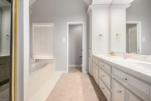2722 Masters Dr, League City, TX 77573 - full bath featuring double vanity, baseboards, a sink, and a bath