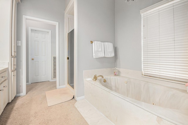 2722 Masters Dr, League City, TX 77573 - full bathroom featuring a stall shower, baseboards, a garden tub, and vanity