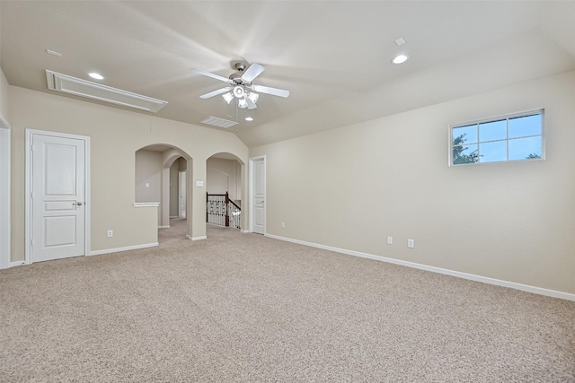 2524 Garnetfield Ln, Friendswood, TX 77546 - spare room with attic access, a ceiling fan, arched walkways, light colored carpet, and baseboards