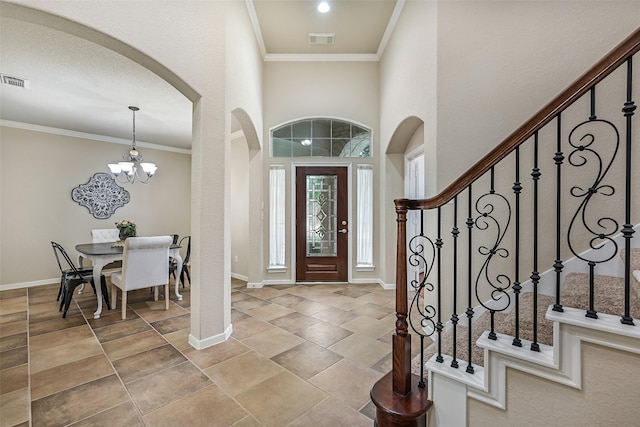 2524 Garnetfield Ln, Friendswood, TX 77546 - entryway with arched walkways, baseboards, crown molding, stairs, and a chandelier