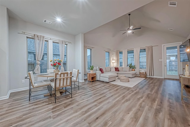 living area featuring ceiling fan, wood finished floors, and visible vents
