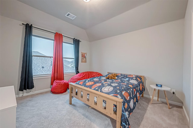 bedroom featuring carpet floors, baseboards, vaulted ceiling, and visible vents