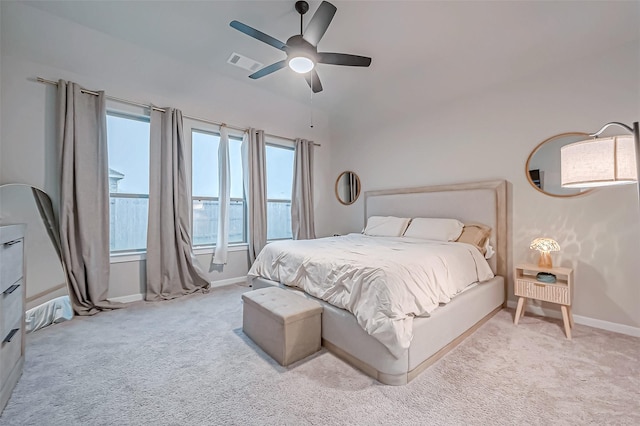 bedroom with baseboards, ceiling fan, light carpet, and visible vents