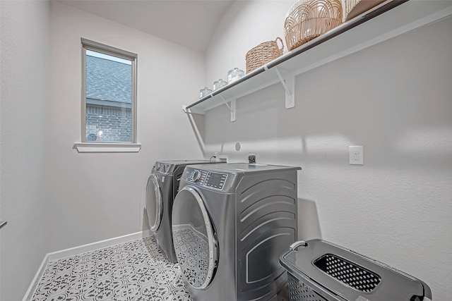 laundry room with baseboards, laundry area, and washer and clothes dryer