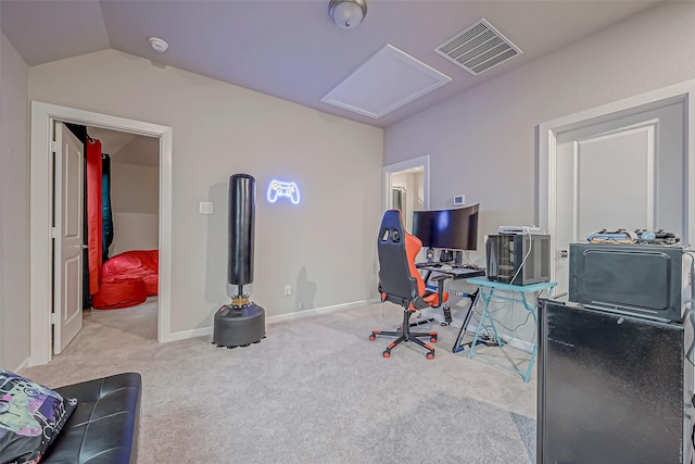 office with attic access, visible vents, vaulted ceiling, carpet floors, and baseboards