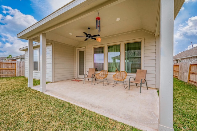 view of patio / terrace with fence and ceiling fan