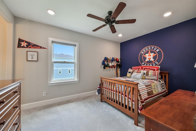 carpeted bedroom featuring baseboards, recessed lighting, and ceiling fan
