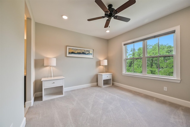 empty room with baseboards, ceiling fan, carpet, and recessed lighting