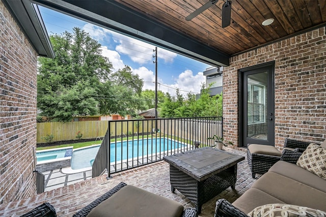 view of patio / terrace with ceiling fan, outdoor lounge area, a fenced backyard, and a fenced in pool