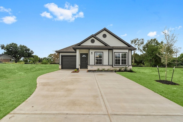 11869 E Gate Dr, Willis, TX 77318 - view of front of home with an attached garage, driveway, and a front lawn