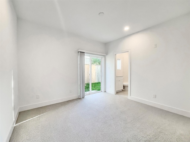 7705 Westside Villas Ln, Houston, TX 77055 - empty room with baseboards, recessed lighting, and light carpet